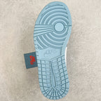 Light blue rubber outsole with Nike Air logo and circular traction grooves