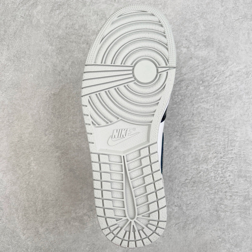 White rubber outsole with circular traction pattern and grid herringbone lines