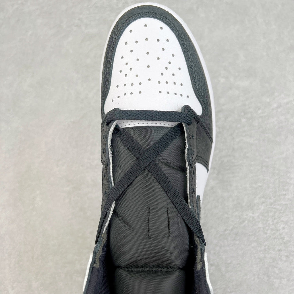 High-top sneakers with perforated white toe panel and dark lace-up front