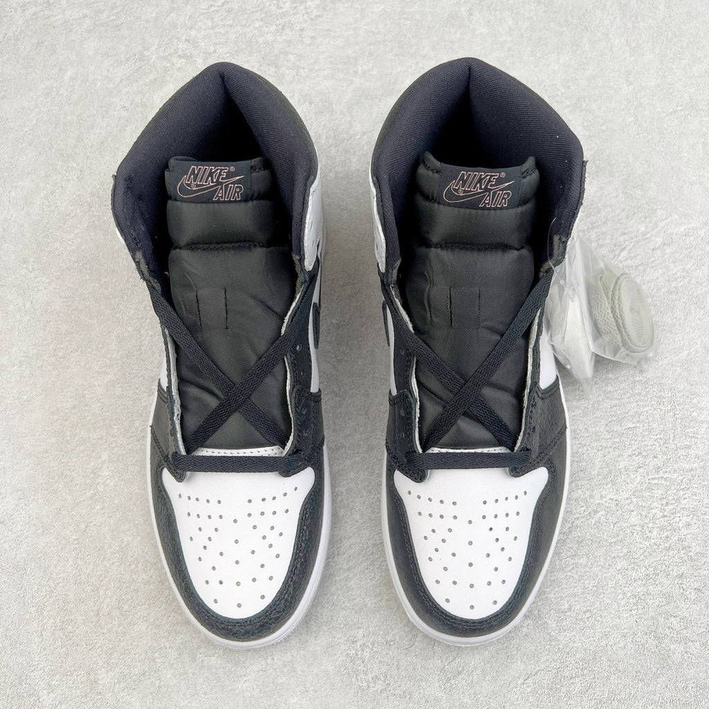 High-top sneakers shown from the tongue and collar, white perforated toe with dark uppers