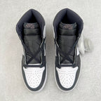 High-top sneakers shown from the tongue and collar, white perforated toe with dark uppers