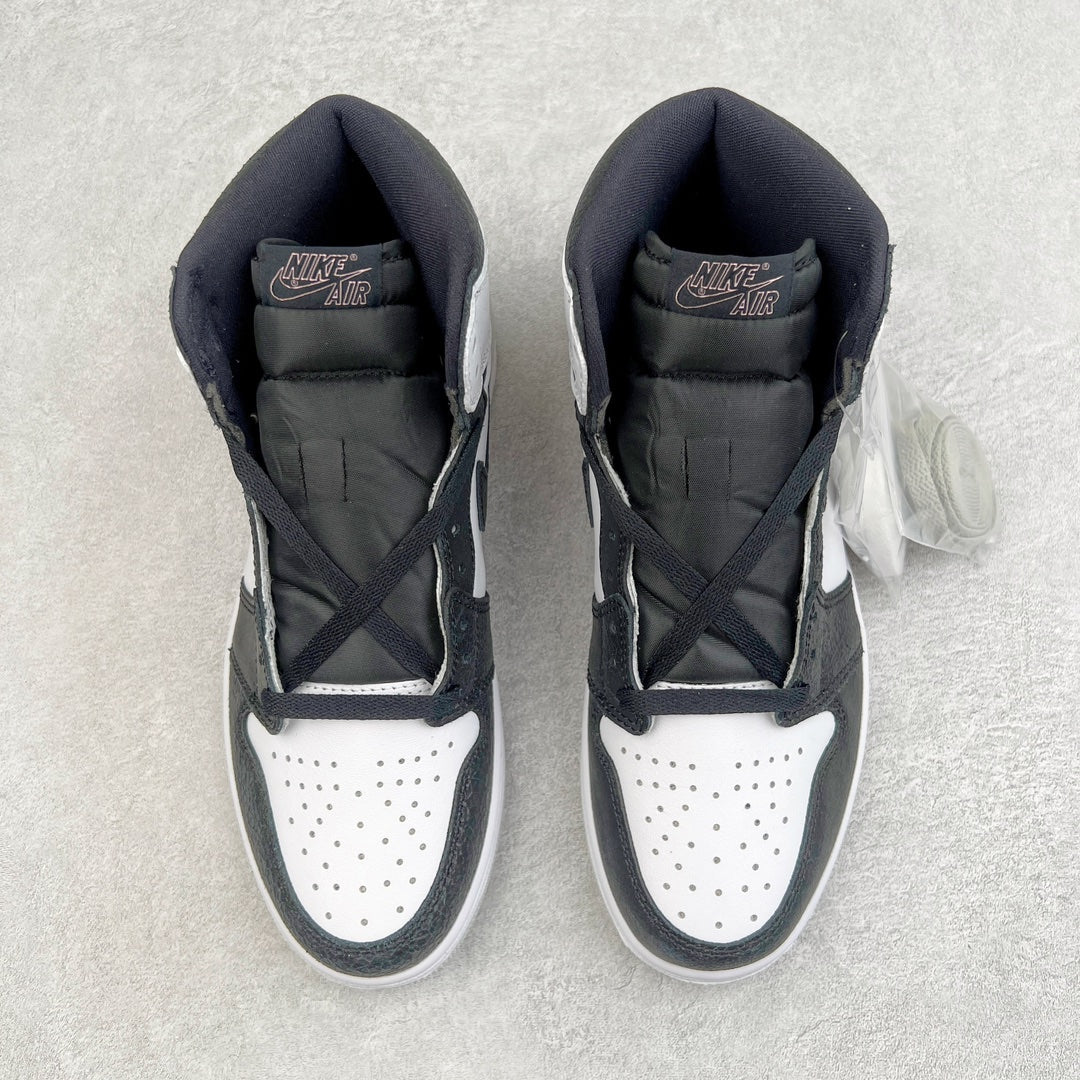 High-top sneakers shown from the tongue and collar, white perforated toe with dark uppers