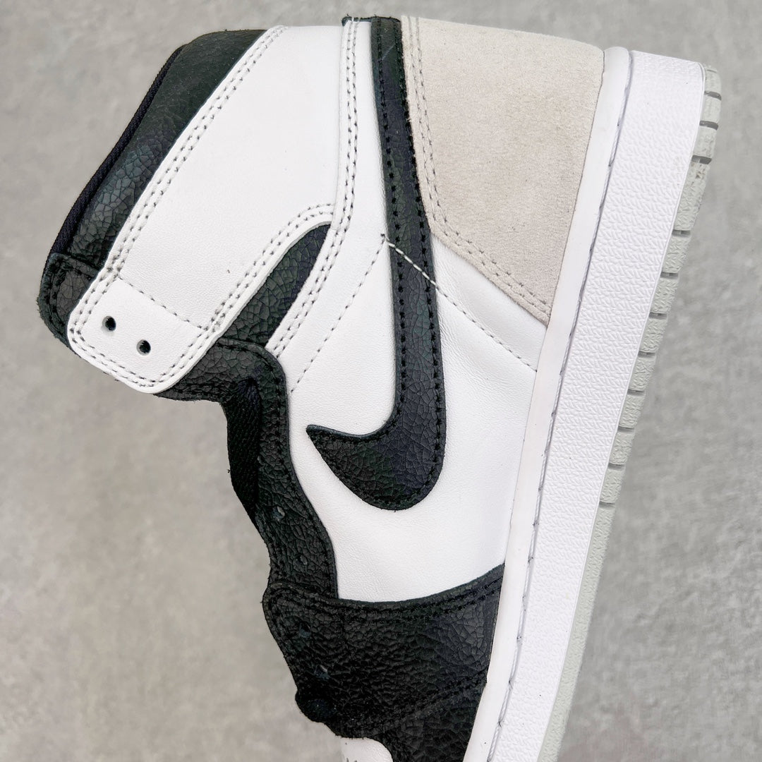 High-top sneakers side view with white midsole, black overlays, and white quarter panel