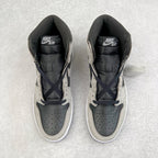 Pair of high-top sneakers with padded black collar, black tongue lining, and navy laces.