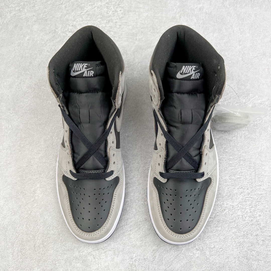 Pair of high-top sneakers with padded black collar, black tongue lining, and navy laces.