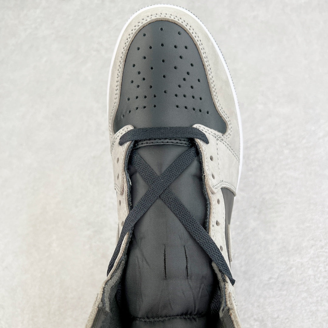 High-top sneaker toe with perforated leather and navy crisscross laces.