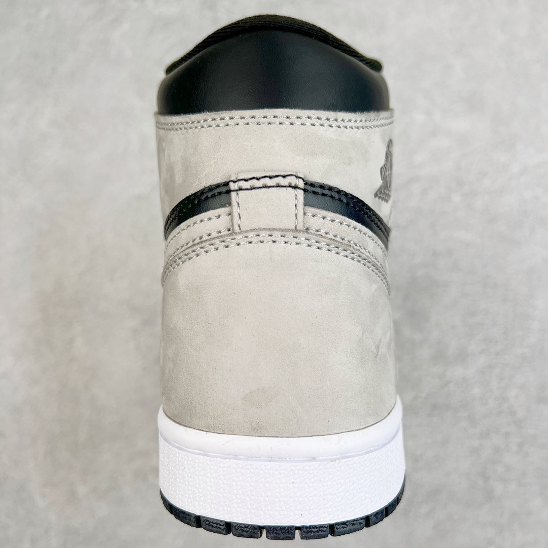 High-top sneaker back with cream heel panel, navy collar lining, and white midsole.