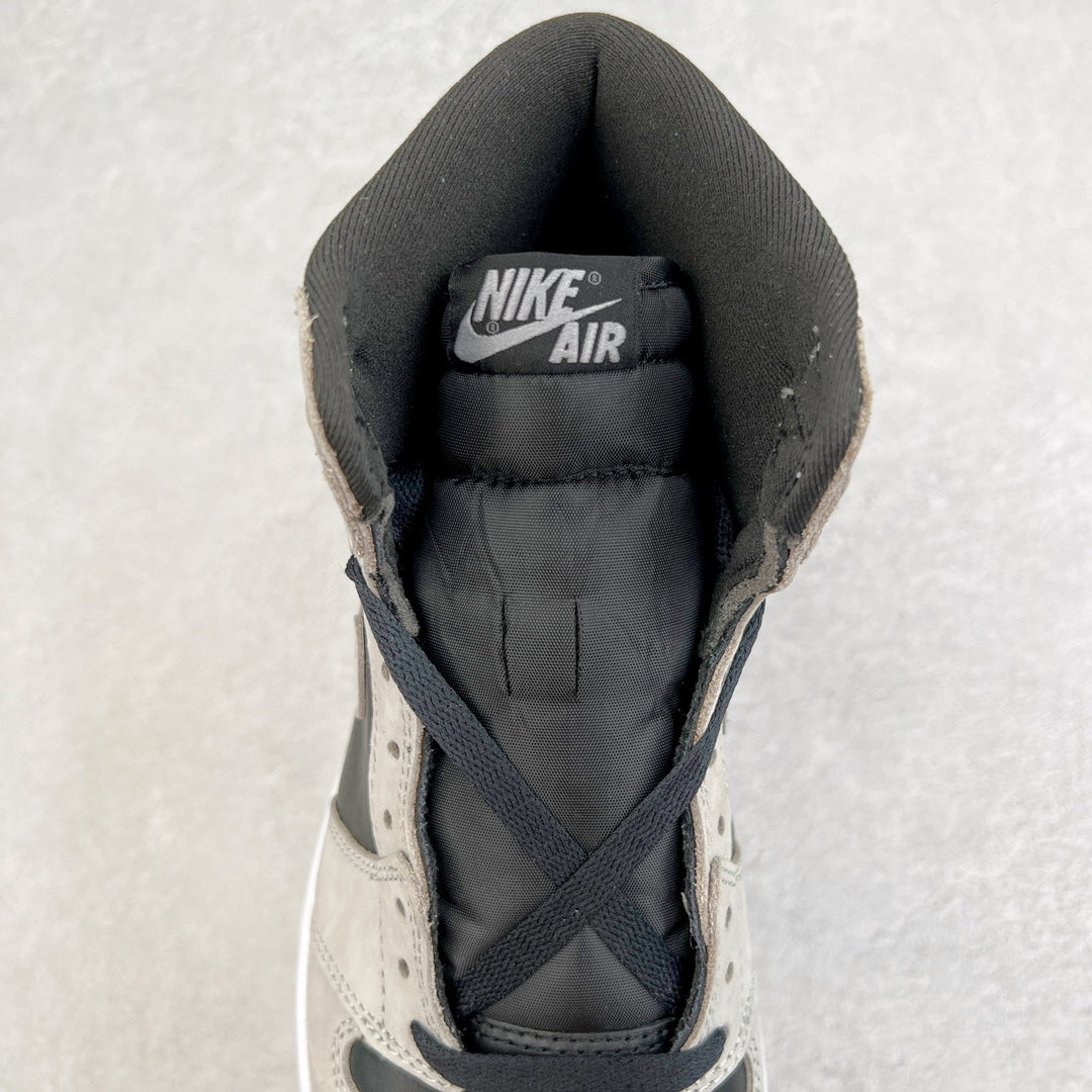 High-top sneaker heel with Nike Air tag, padded black collar, and cream upper.