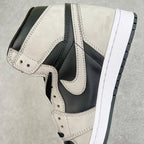 High-top sneakers with cream leather toe box, navy collar, and white midsole.