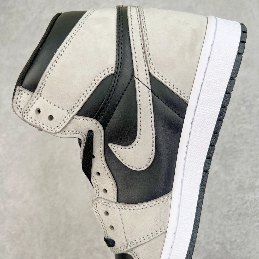 High-top sneakers with cream leather toe box, navy collar, and white midsole.
