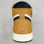 High-top sneaker heel in tan suede with black collar and white midsole edge.