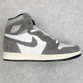 High-top sneakers with white and smoke gray panels, gray swoosh, black outsole.