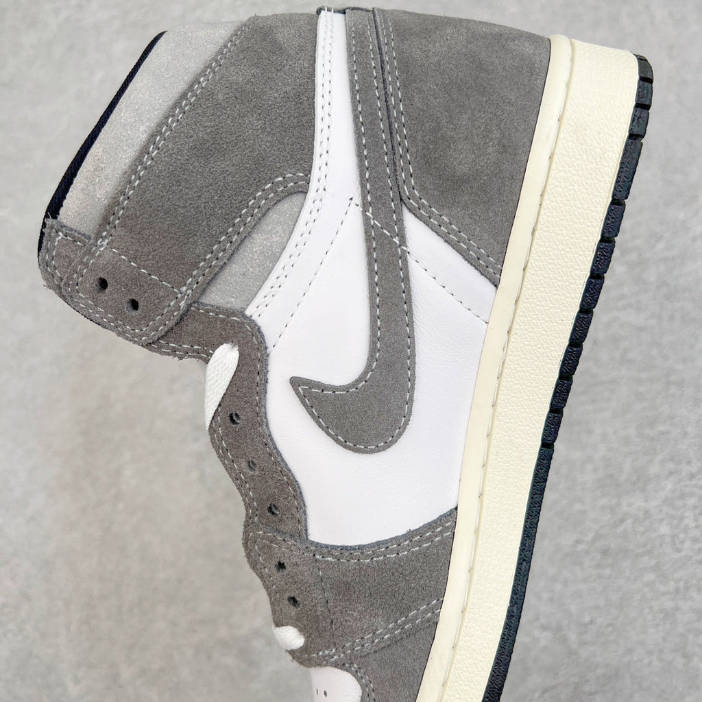 High-top sneakers side view with white swoosh, smoke gray suede, cream midsole.