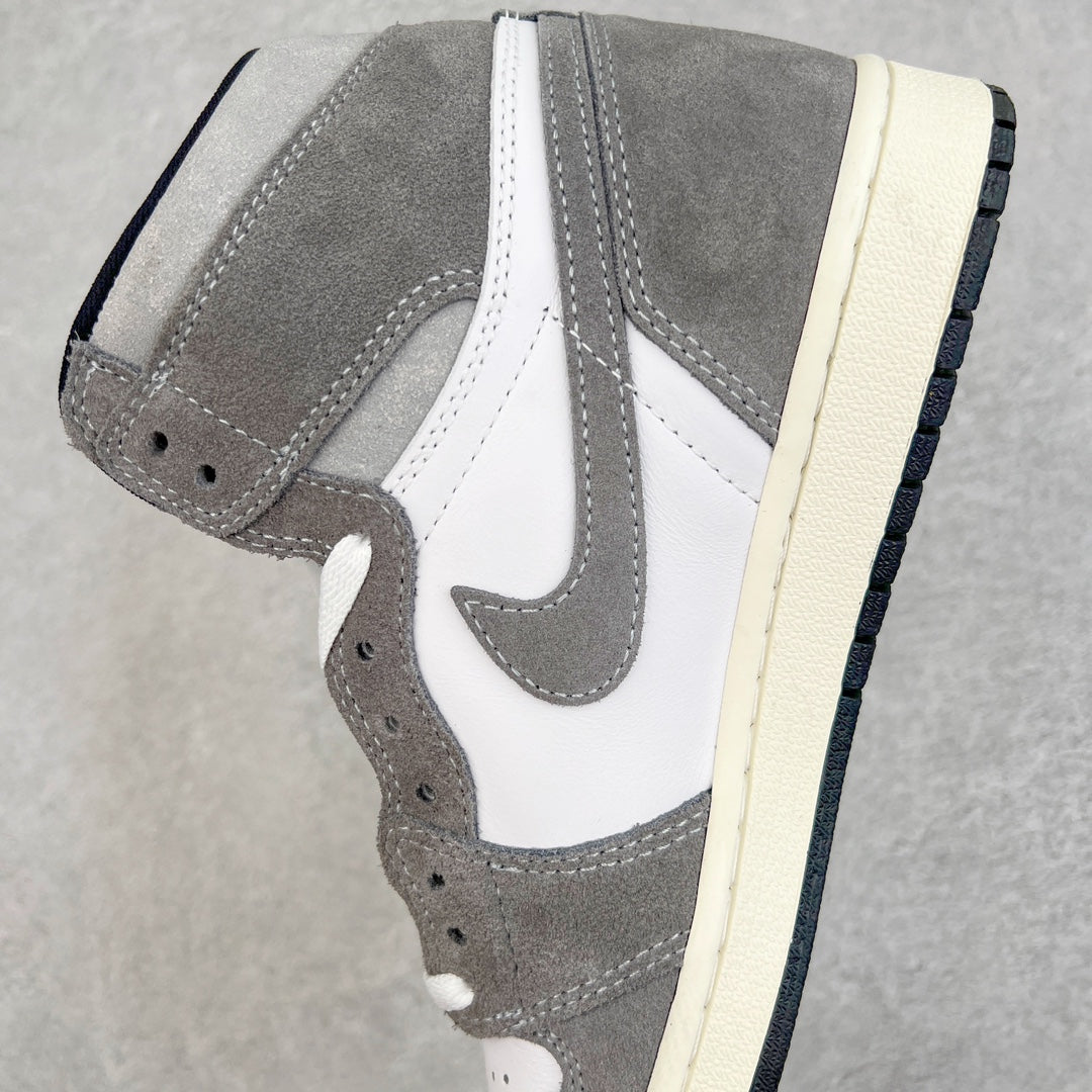 High-top sneakers side view with white swoosh, smoke gray suede, cream midsole.