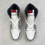 High-top sneakers with white laces, gray uppers, navy interior, Nike Air tongue logo.