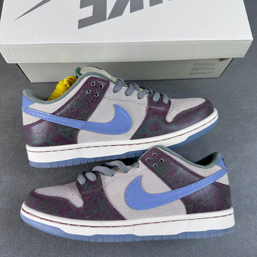 Pair of low-top skate shoes in multicolor with light-blue swoosh and white soles