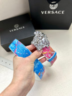 Versace belt with bright blue and pink floral strap and silver lion buckle