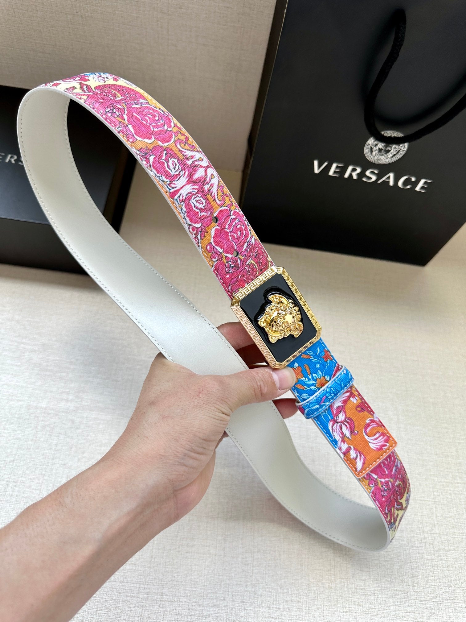 Versace belt with pink and blue patterned strap, gold Medusa buckle, wide profile