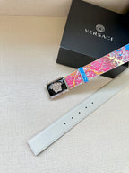Versace belt with multicolor patterned strap and gold Medusa buckle, on white leather