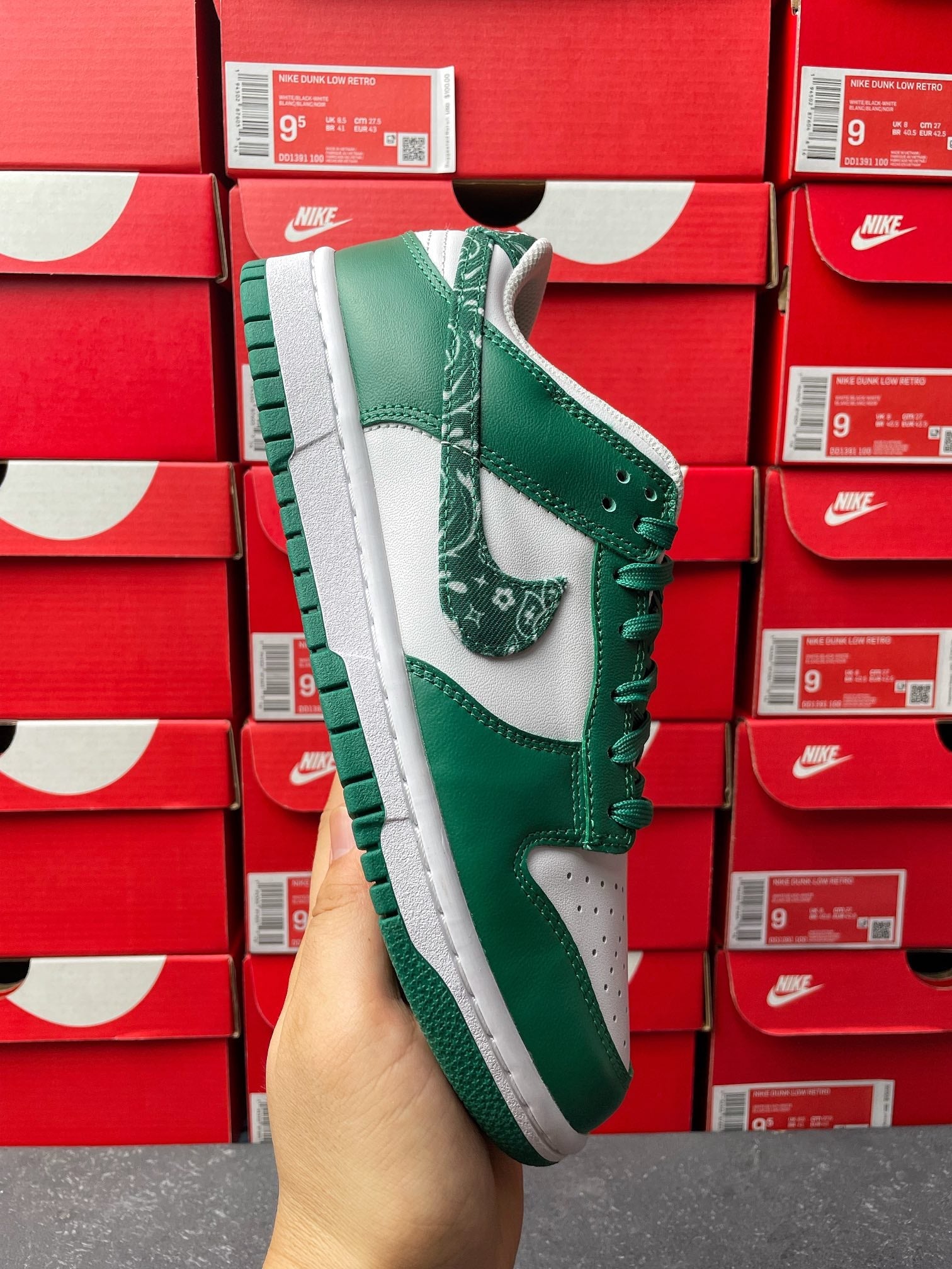 Nike Dunk Low sneaker, green upper with white midsole and patterned green swoosh