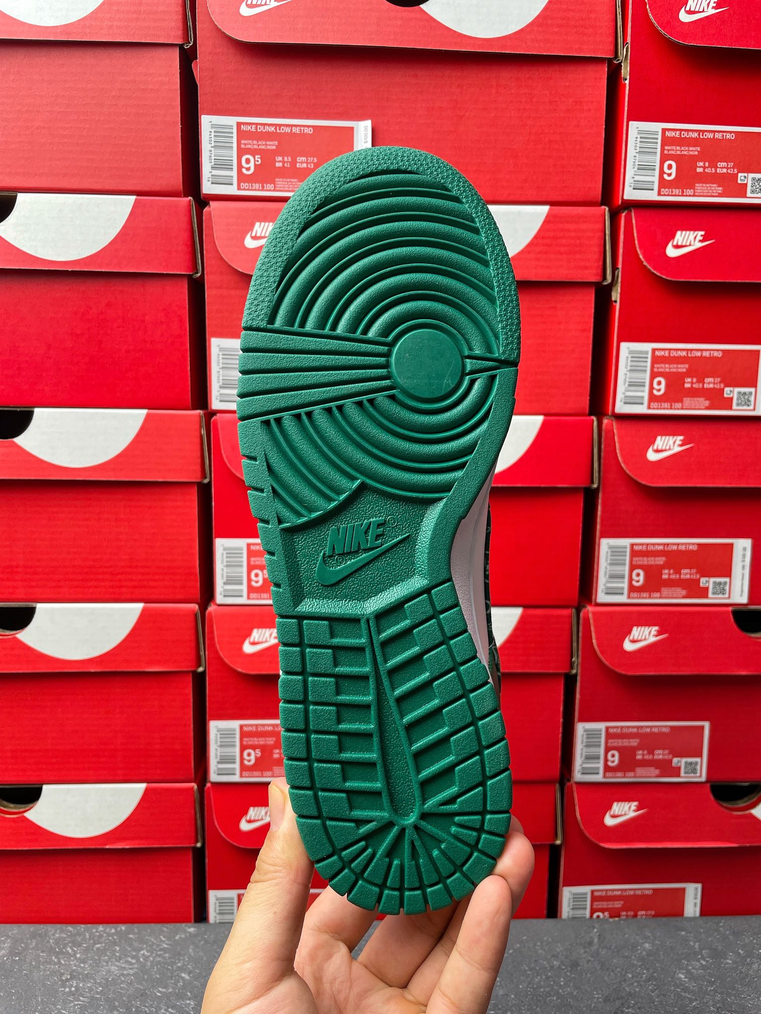 Nike Dunk Low outsole view in green with grid tread and circular traction pattern