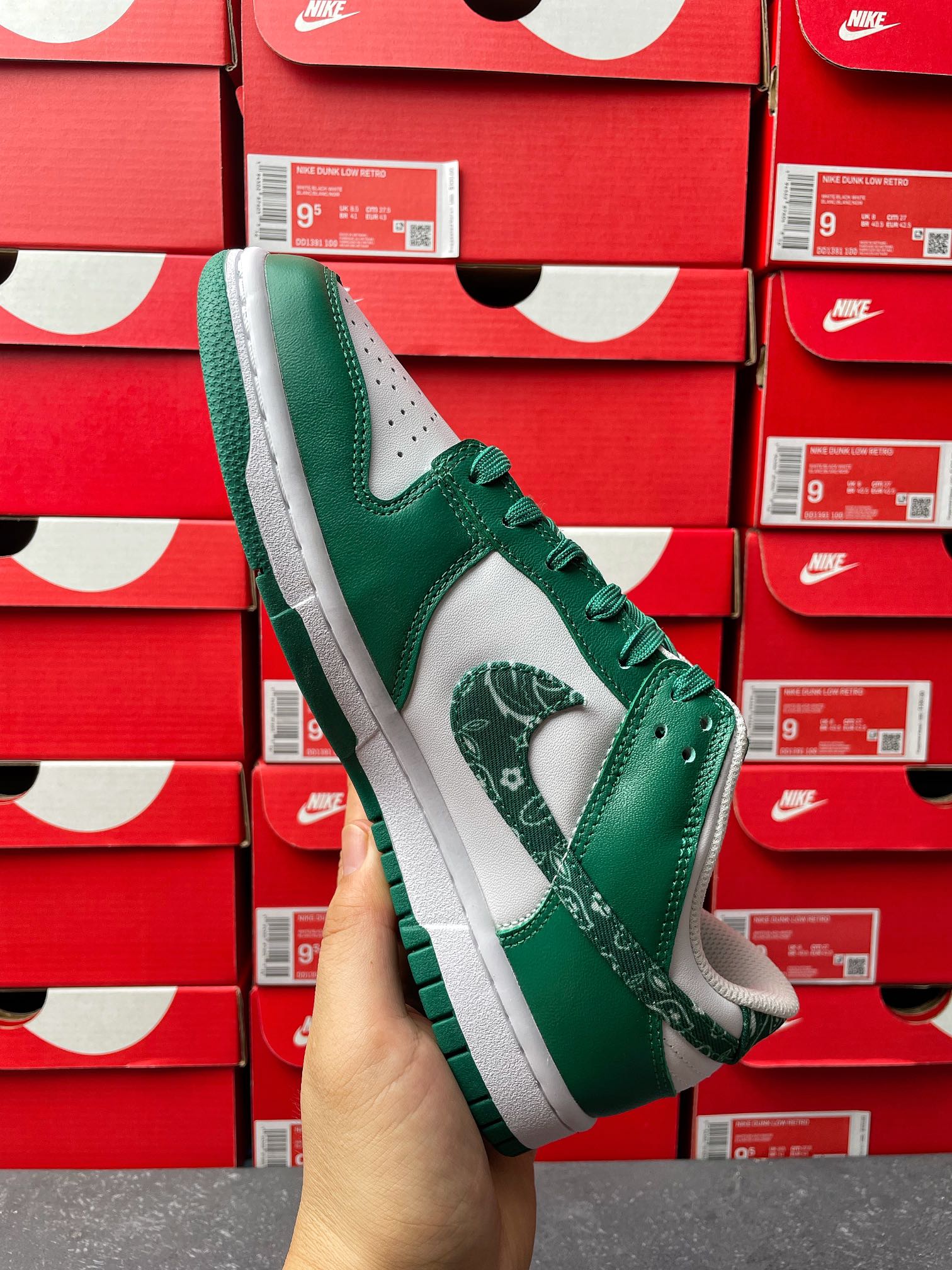 Nike Dunk Low sneaker angled view, green upper with white midsole and green lace trim