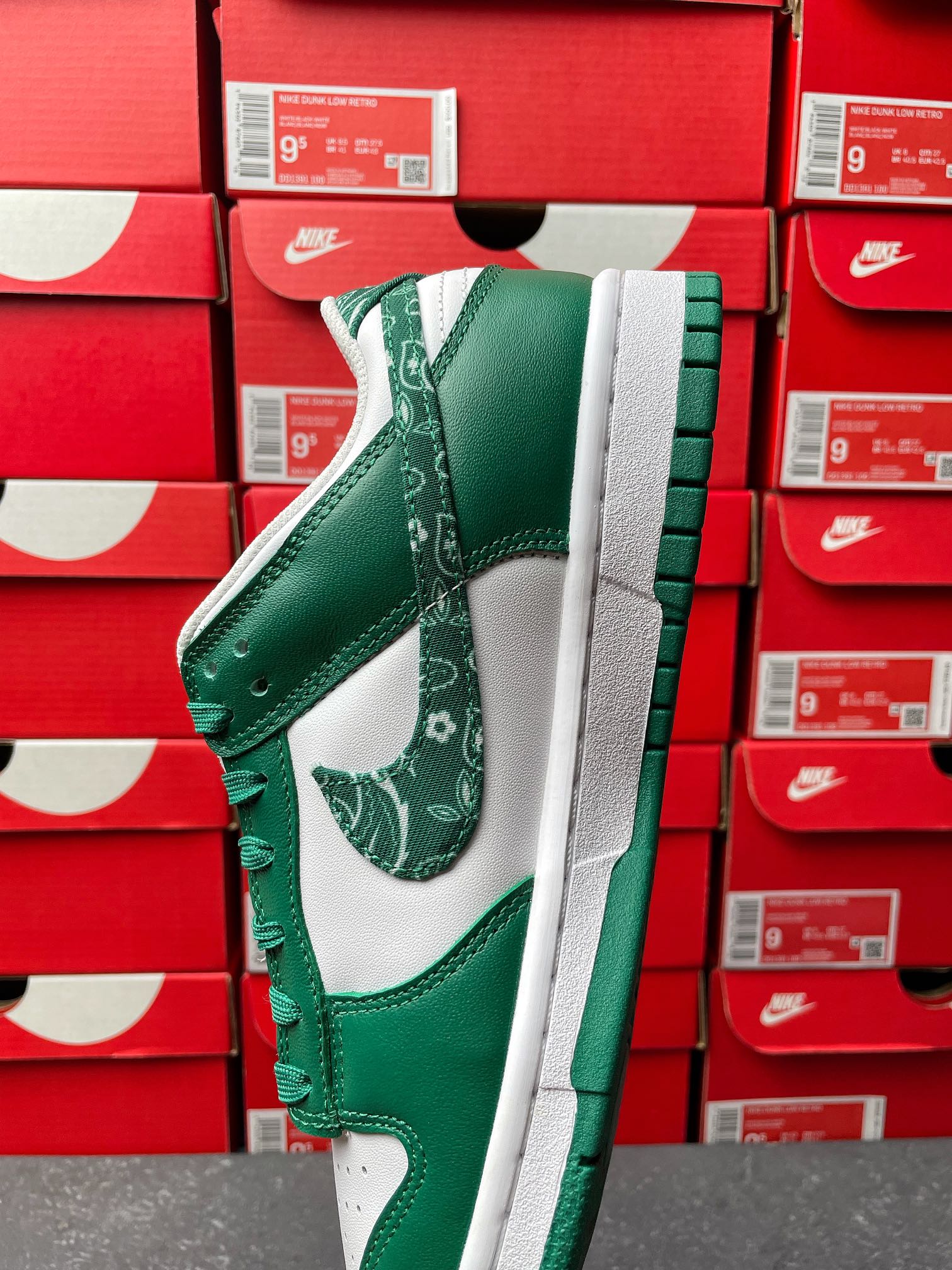 Nike Dunk Low side view sneaker in green leather with white panel and green laces