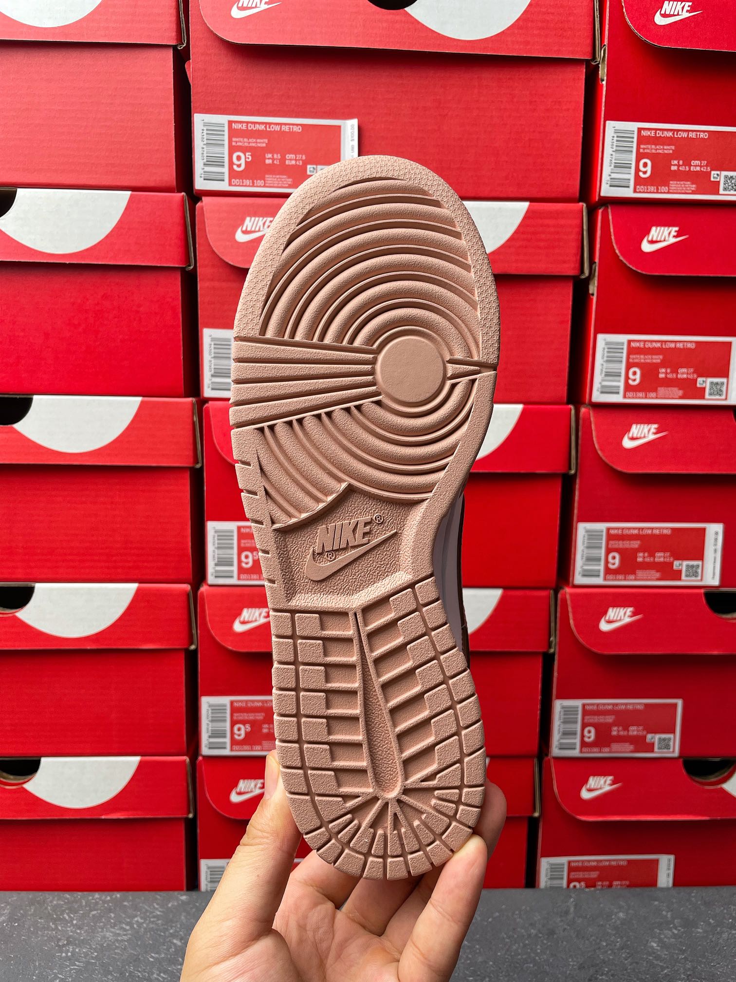 Brown low-top sneaker outsole with traction tread and Nike logo