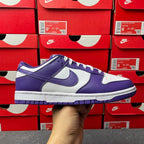 Nike Dunk Low sneaker in purple and white, lace-up with Nike swoosh on side