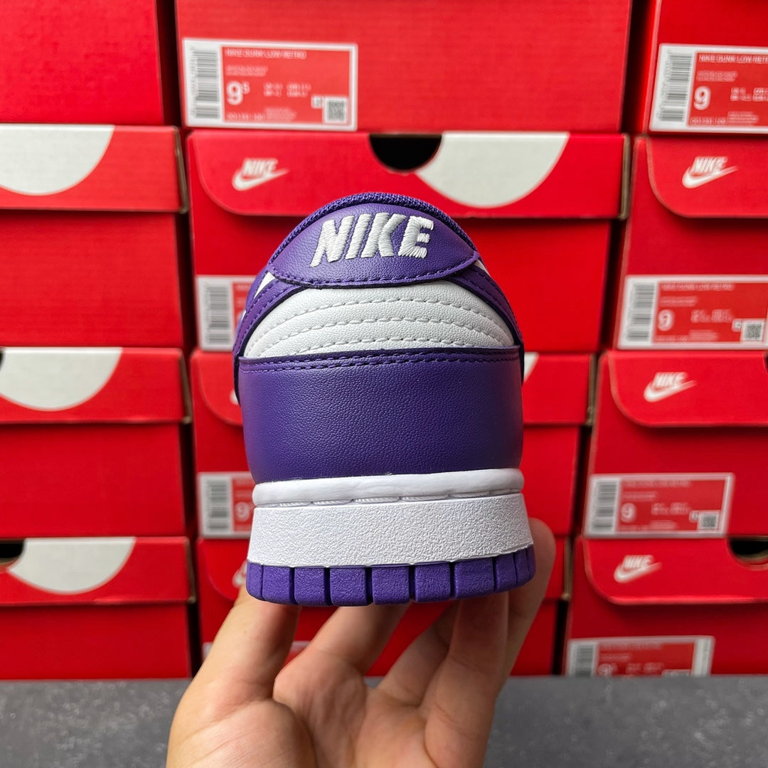 Nike Dunk Low sneaker heel view, purple back with white outsole and Nike text