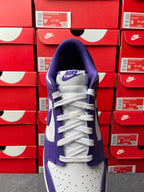 Nike Dunk Low sneaker, purple and white with Nike logo tongue and white laces