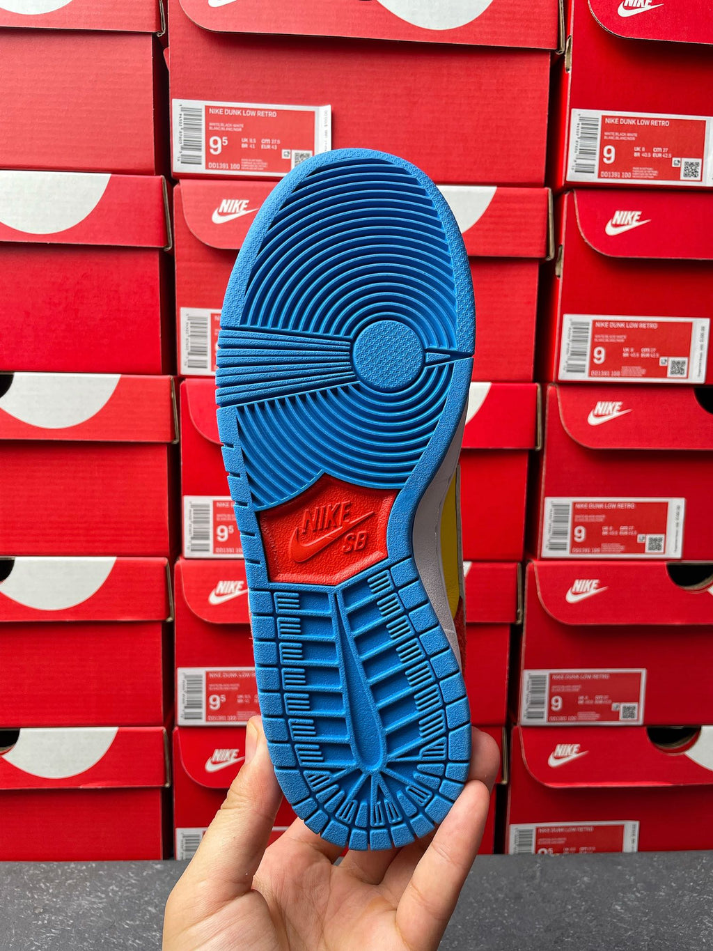 Nike Dunk Low sneaker, blue rubber outsole with tread pattern