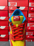 Nike Dunk Low sneaker, heel and tongue view with NIKE SB text, red laces