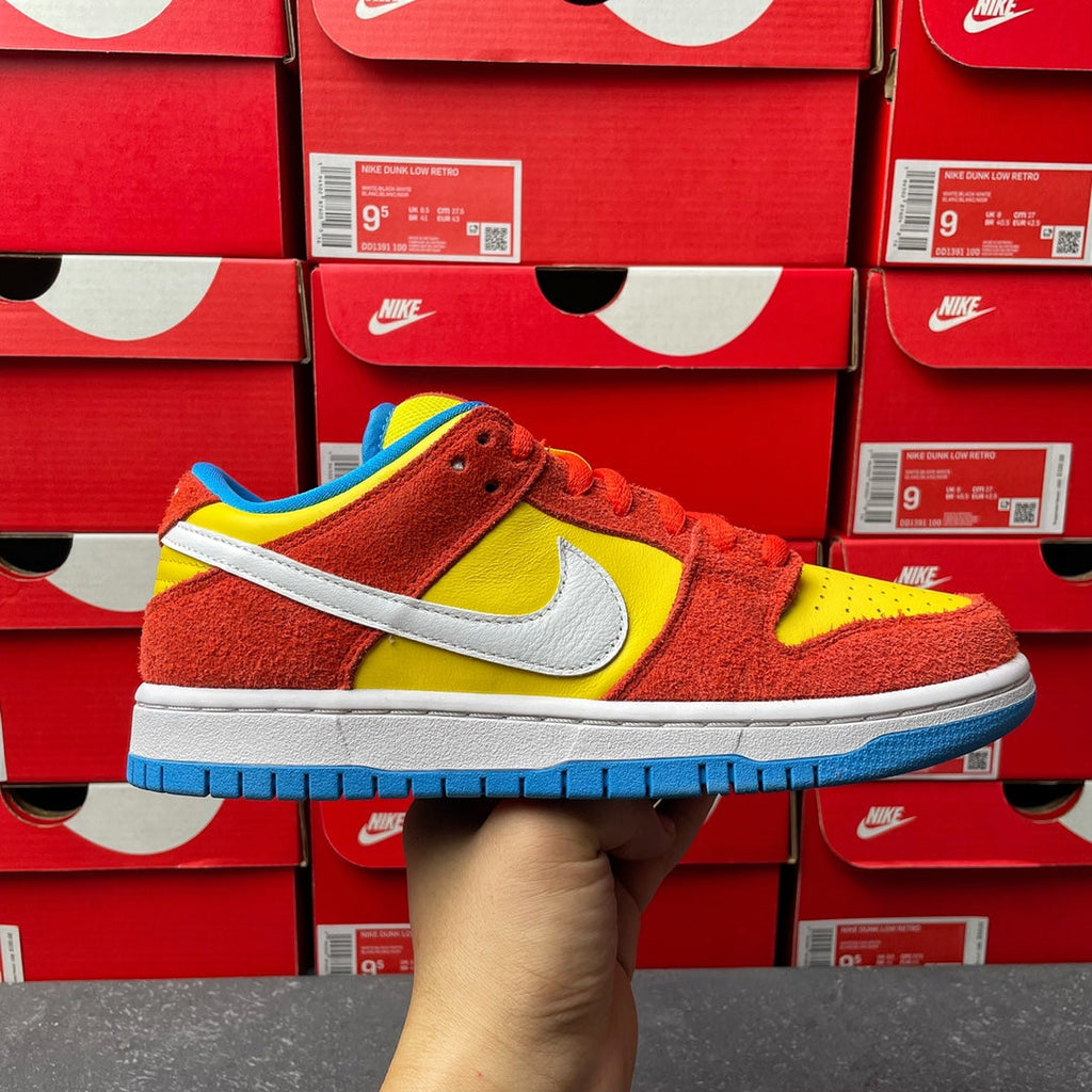 Nike Dunk Low sneaker, red suede with yellow swoosh and blue outsole, side view
