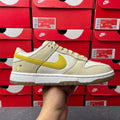 Nike Dunk Low sneaker, cream leather with lemon-yellow swoosh and laces