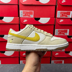 Nike Dunk Low sneaker, cream leather with lemon-yellow swoosh and laces