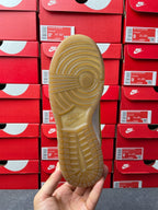 Nike Dunk Low sneaker, outsole view; textured cream rubber tread