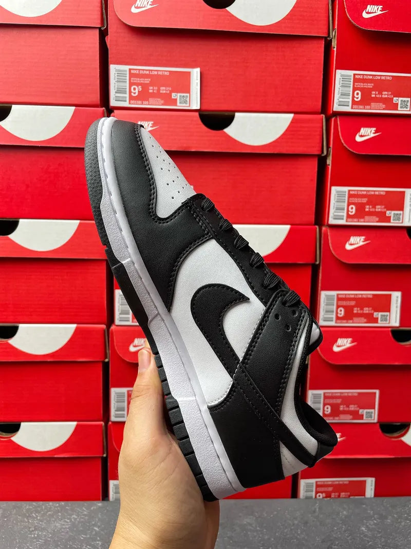 Nike Dunk Low Panda sneaker front-side view, black laces over white-and-black panels