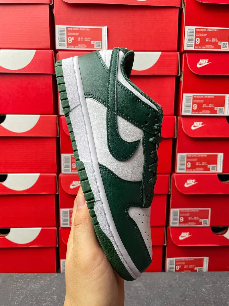Nike Dunk Low sneaker angled side view with dark green upper and white midsole