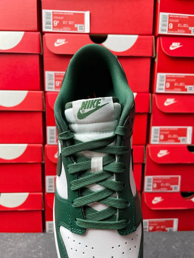 Nike Dunk Low tongue and lace view with green mesh lining and white Nike label