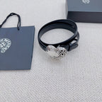 Dark blue leather belt featuring a heart-shaped silver buckle