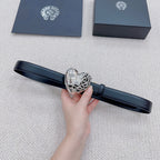 Dark blue belt with heart buckle detail and decorative metalwork center
