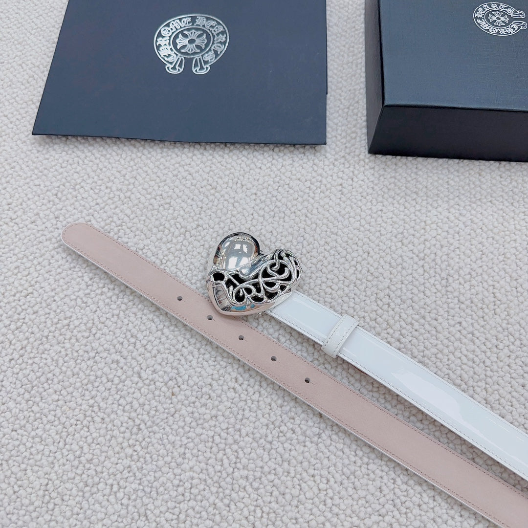 White belt with silver heart buckle and visible perforation holes