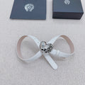 White belt with silver heart buckle and filigree details