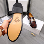 Versace leather loafer sole view, dark brown upper with black outsole and logo