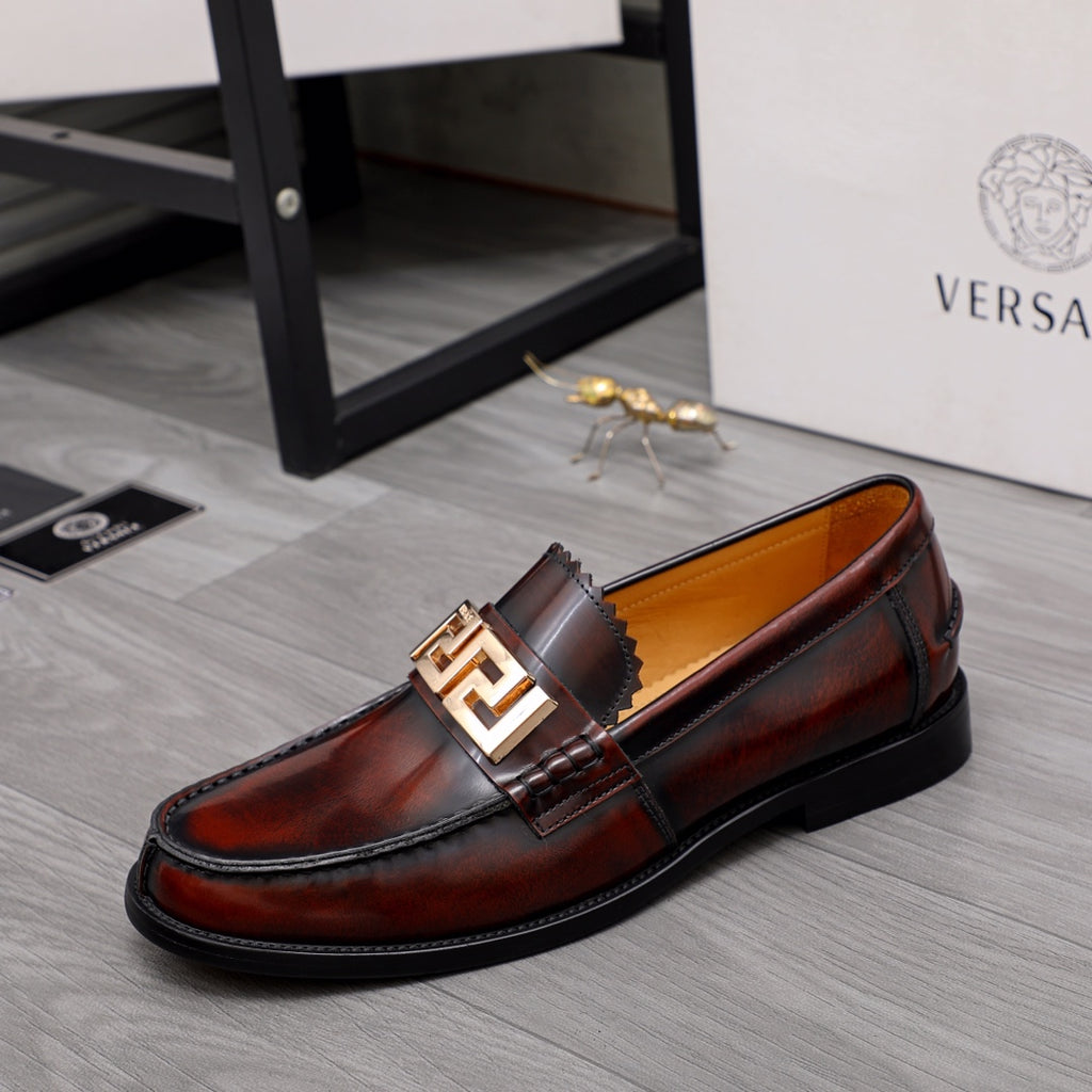 Versace leather loafer in dark brown with gold buckle detail and stitched apron