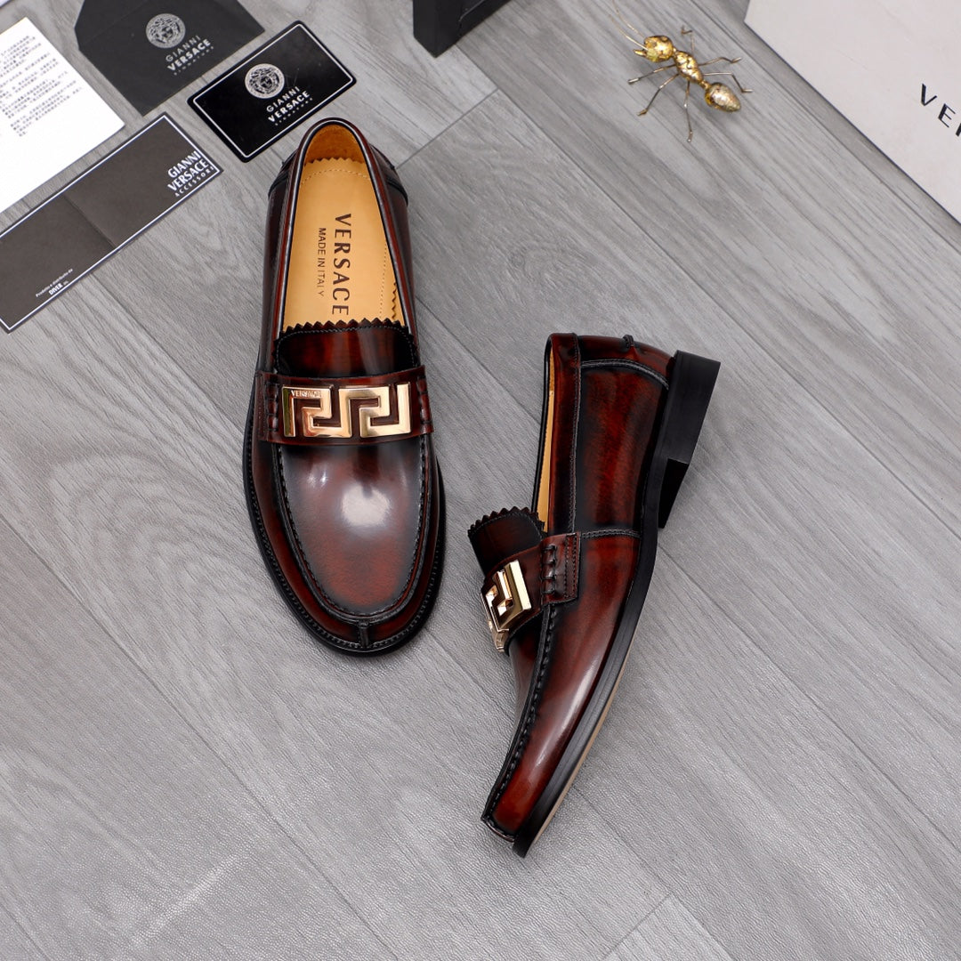 Versace leather loafers, dark brown slip-on style with gold buckle and black soles