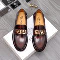 Versace leather loafers with gold Greek-key buckle, dark brown shine