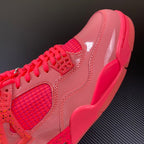 Pink Air Jordan 4 sneaker side view with red laces and molded panel
