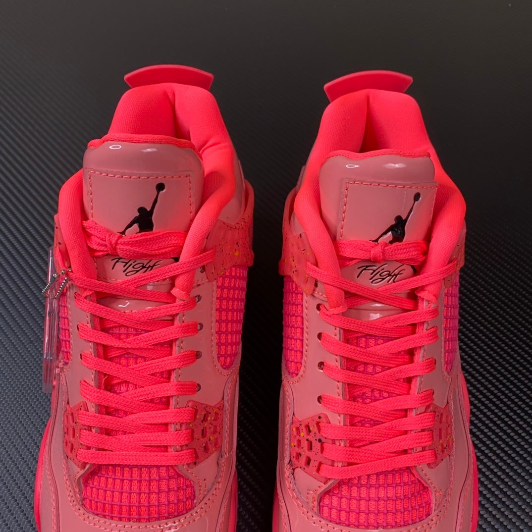 Pink Air Jordan 4 sneaker pair with heel tabs and red laces